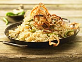 Stewed rice with chilli and fried onions
