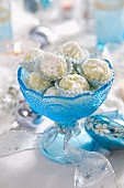 White chocolate pralines in a blue glass dish for Christmas