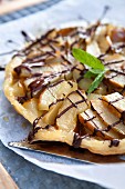 Pear pie with chocolate sauce