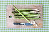 Asparagus on chopping board