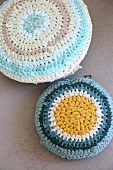 Crocheted cushions made from T-shirt yarn in shade of blue