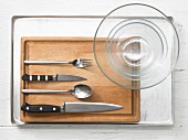 Kitchen utensils for making baked fish with an apple vinaigrette