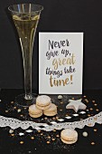 A champagne glass, christmas cookies and a New Year's eve label