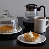 Small pumpkin pies and coffee