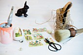 Vintage album pictures with Easter motifs, twine and old-fashioned paintbrush