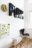 Decorative letters on wall above rocking sheep and chair