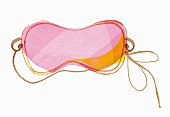 A pink sleeping mask (illustration)