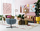 Retro style living room with pink wall and various wall decorations