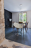 Modern shell chair and black floor in dining room