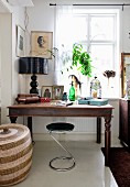 Modern chrome stool at rustic desk