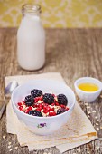 Muesli with blackberries and pomegranate seeds