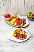 Pork schnitzel with caramelized onion and baked potatoes