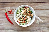 Rice noodles with soya and sesame chicken, cucumber and chilli (Asia)