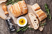 Sliced bread Ciabatta and extra virgin Olive oil on wooden background