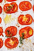 Baked tomatoes on textured background