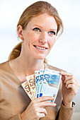 Woman holding Euros