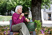 Elderly woman on a bench