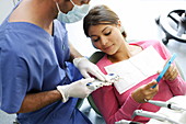 Dentist examining patient