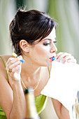 Woman using a breathalyser