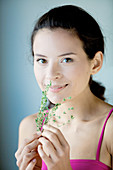 Woman smelling thyme