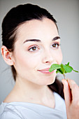 Woman smelling mint