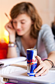 Teenage girl drinking energy drink