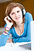 Teenage girl listening to music