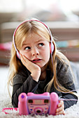 5 year old girl listening to music