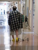 Patient walking in a hospital corridor