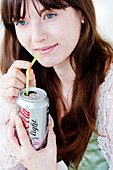 Woman drinking light soda