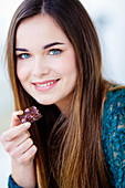 Woman eating chocolate