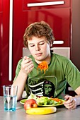 Teenager eating