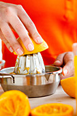 Woman squeezing oranges