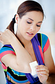 Woman applying gauze compress
