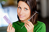 Woman holding contraceptives