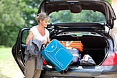 Woman holding some luggages