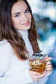 Woman drinking hot beverage