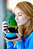 Woman drinking hot beverage