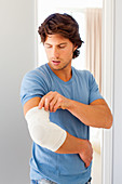 Man wearing a elbow holder