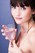 Woman drinking mineral gas water