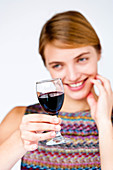 Woman drinking a glass of red wine