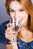 Woman drinking mineral gas water