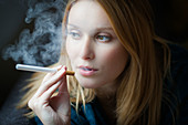 Woman smoking electronic cigarette