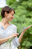 Woman picking lavender flower