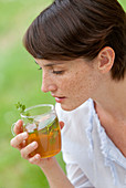 Woman drinking herbal infusion