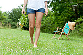 Woman walking on lawn