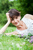 Woman relaxing on grass