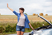 Woman with car trouble