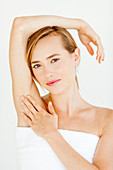 Woman touching her underarm