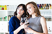 Women drinking red wine